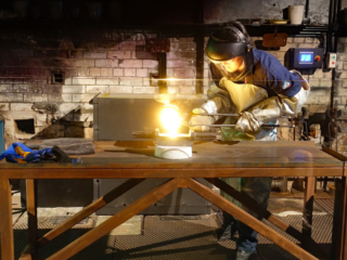 Pouring the liquid gold into the mold