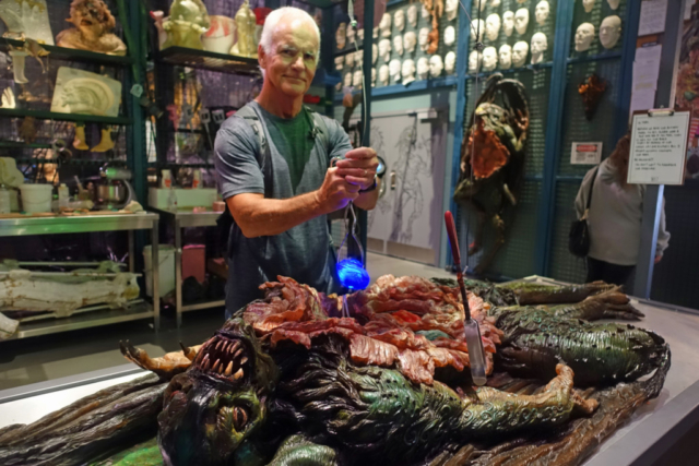 Blair taking body parts out of an alien